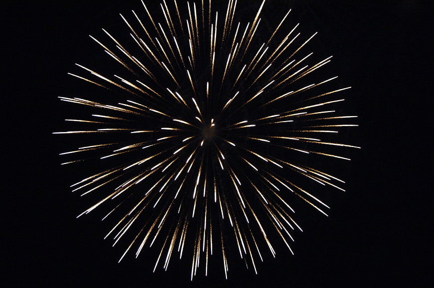 Golden Firework Burst Against Black Night Sky