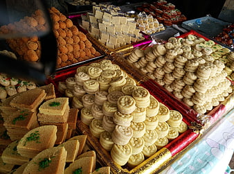 Traditional Indian Sweets Displayed On Market Stalls
