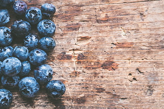 Fresh Blueberries on Rustic Wooden Background with Copyspace