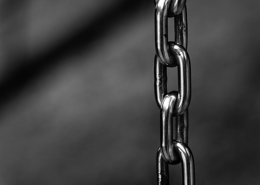 Close-up of metal chain links in black and white