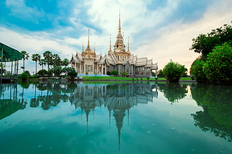 Golden Thai Temple Reflected in Calm Water