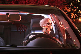 Halloween Skeleton Driver in Car with Red Lighting