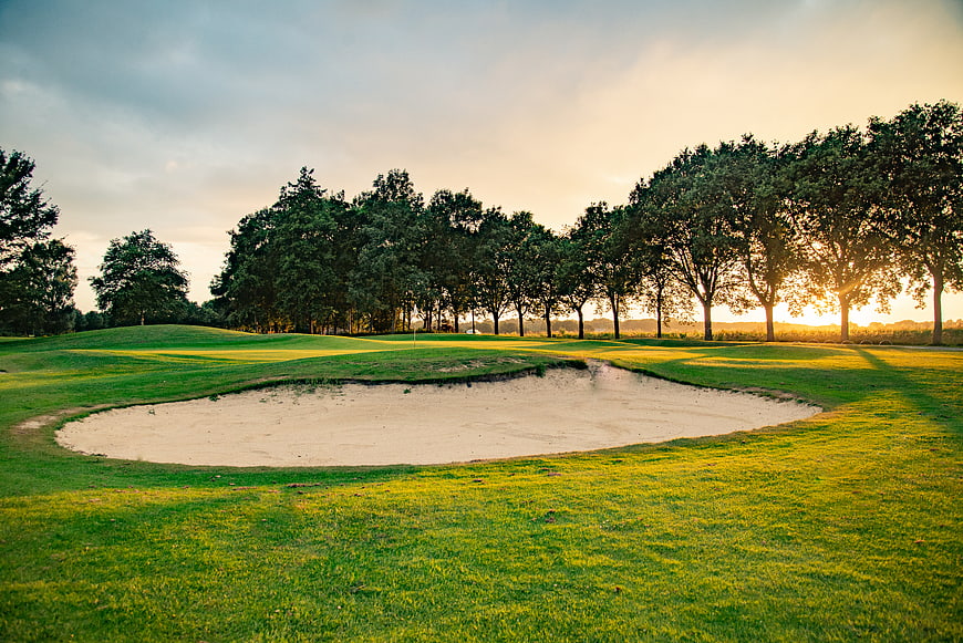Sunlit Golf Course Sand Bunker at Sunset