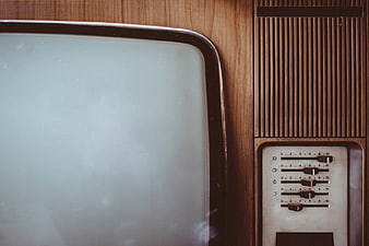 Closeup Vintage Television with Wooden Cabinet and Retro Controls