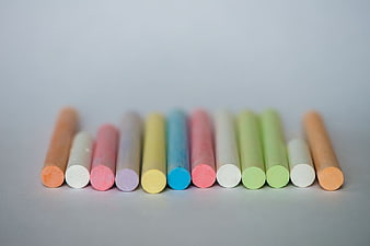 Colorful pastel chalk sticks on white background