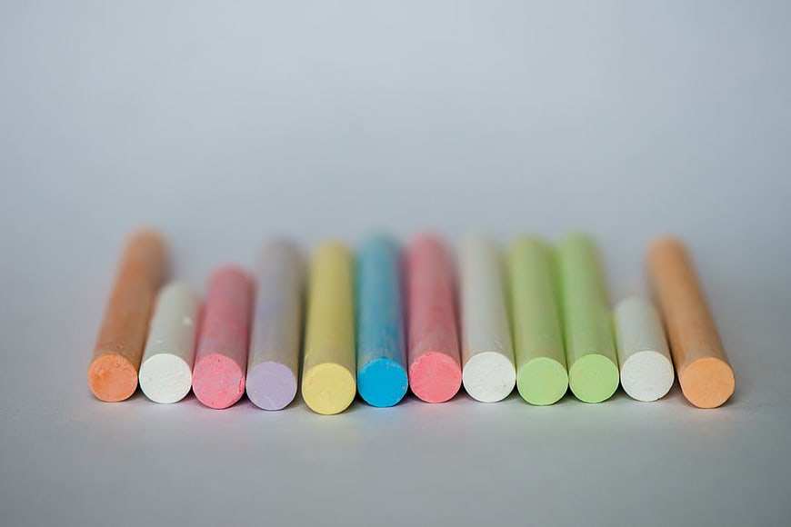 Colorful pastel chalk sticks on white background