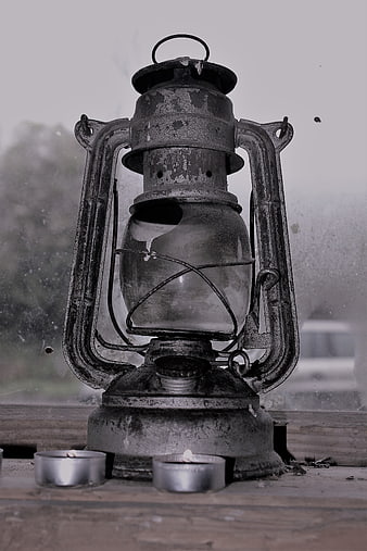 Vintage Rusty Lantern on Wooden Surface