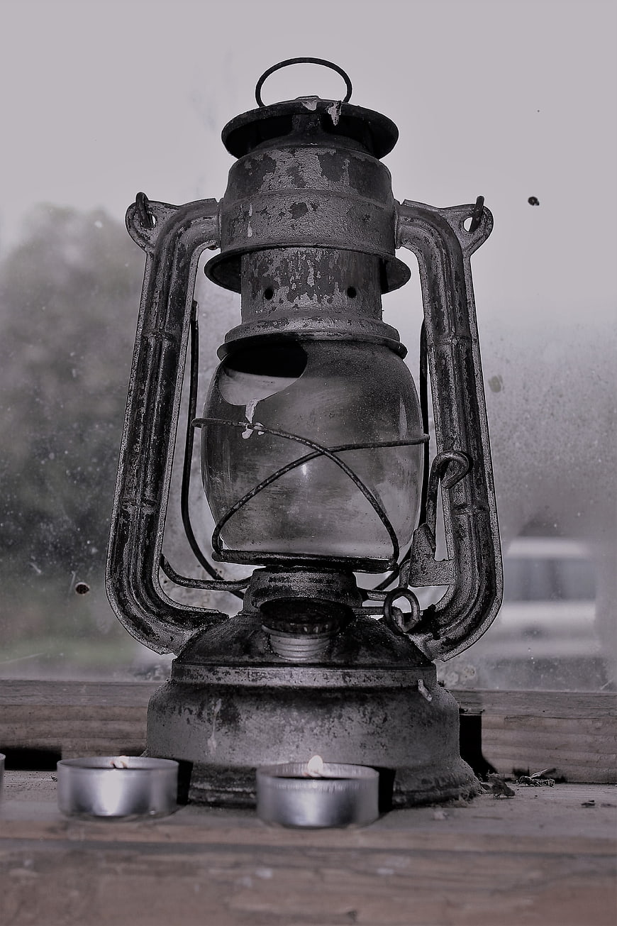 Vintage Rusty Lantern on Wooden Surface