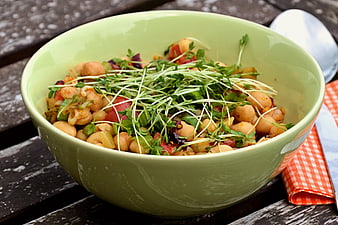 Fresh Chickpea Salad With Microgreens In Green Bowl