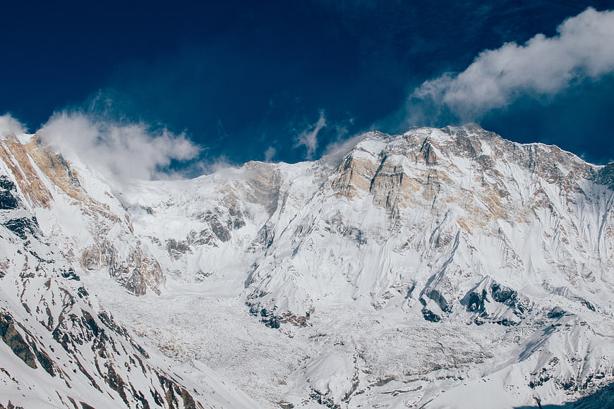Majestic Snow-Covered Mountain Peak with Blue Sky