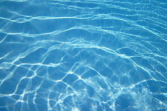 Blue Swimming Pool Water Surface with Caustic Light Patterns