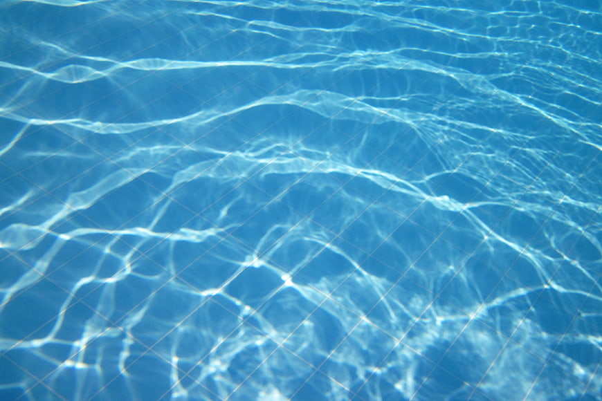 Blue Swimming Pool Water Surface with Caustic Light Patterns