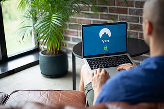 Man using VPN on laptop for internet privacy