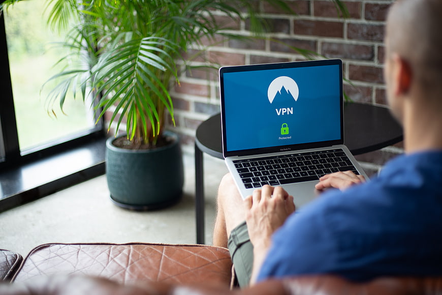 Man using VPN on laptop for internet privacy