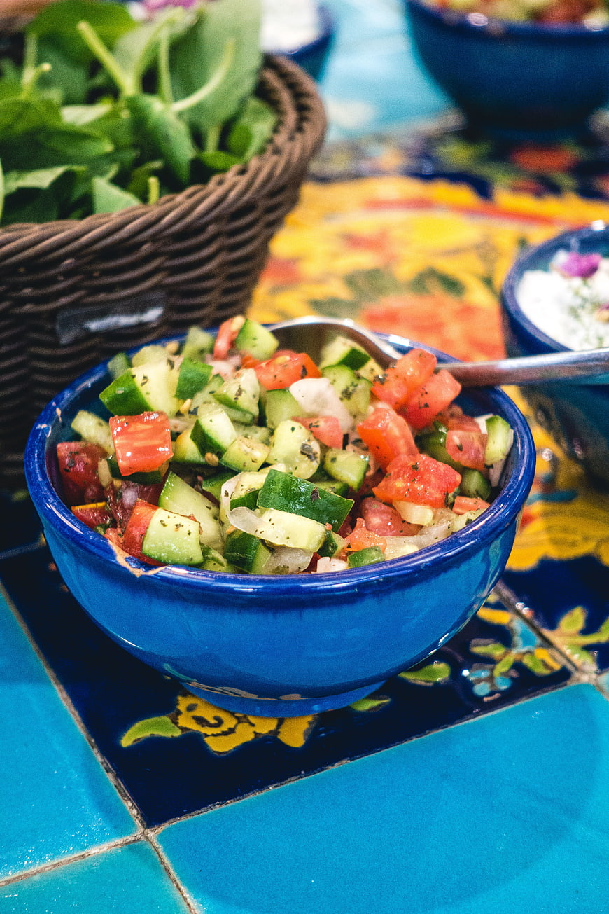 Fresh Cucumber Tomato Salad in Blue Ceramic Bowl