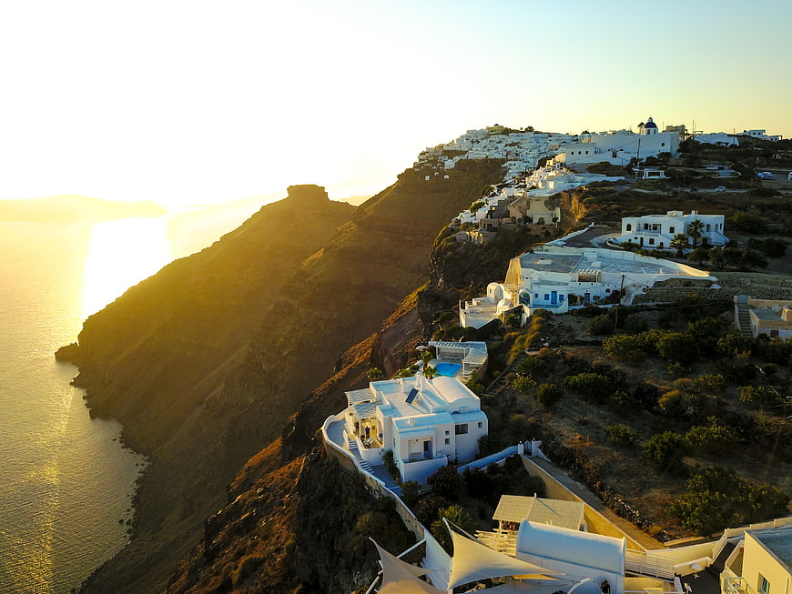 Aerial View of Santorini Cliffside Villages at Golden Hour