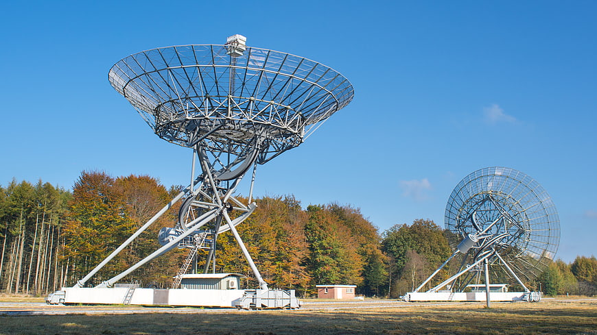 Large Radio Telescopes in Autumn Forest Landscape