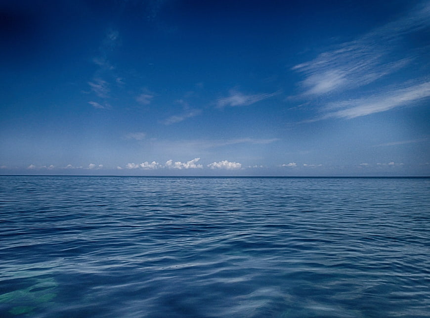 Serene Blue Ocean Horizon with Clear Sky