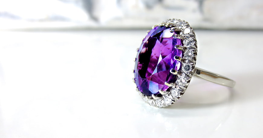 Purple Amethyst Halo Ring with Diamonds on White Background