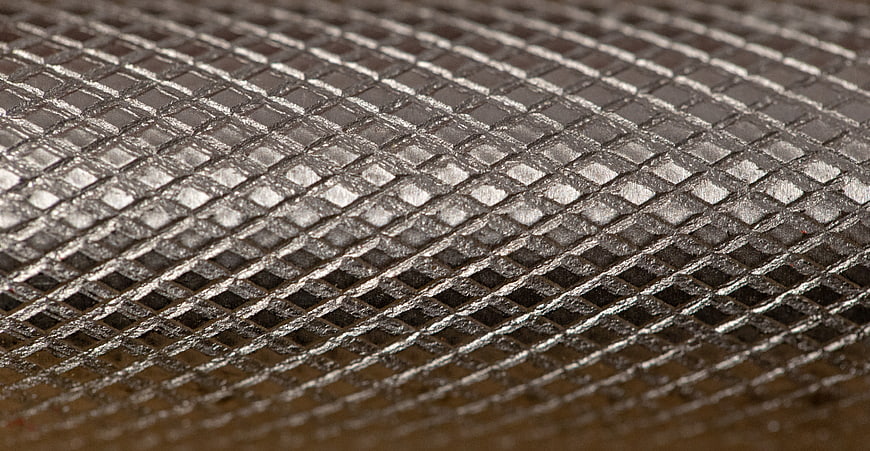 Close-up Macro Shot of Silver Metal Mesh Texture