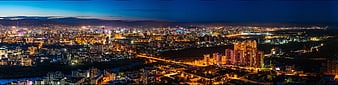 Panoramic Night View of Ulaanbaatar Cityscape with Mountains
