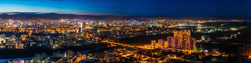 Panoramic Night View of Ulaanbaatar Cityscape with Mountains