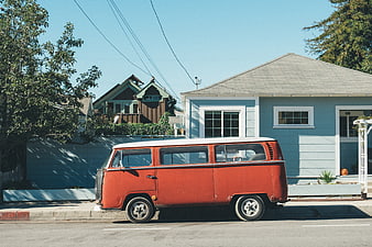 Vintage Red VW Bus Parked on Residential Street