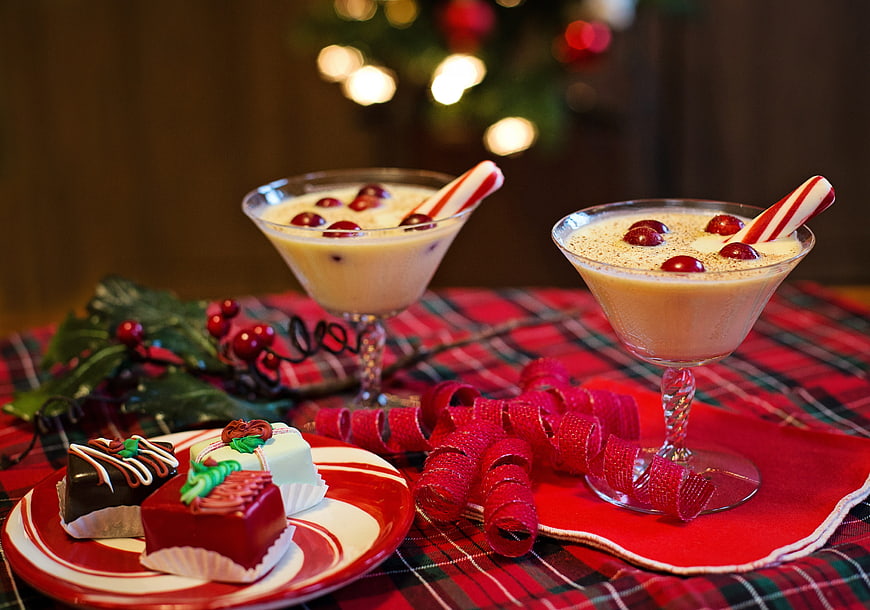 Festive Christmas Eggnog and Holiday Desserts on Plaid Table
