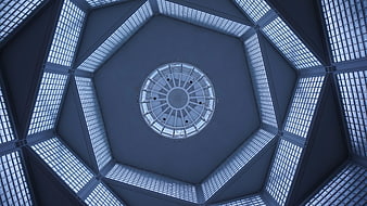 Hexagonal skylight ceiling with geometric blue architectural pattern
