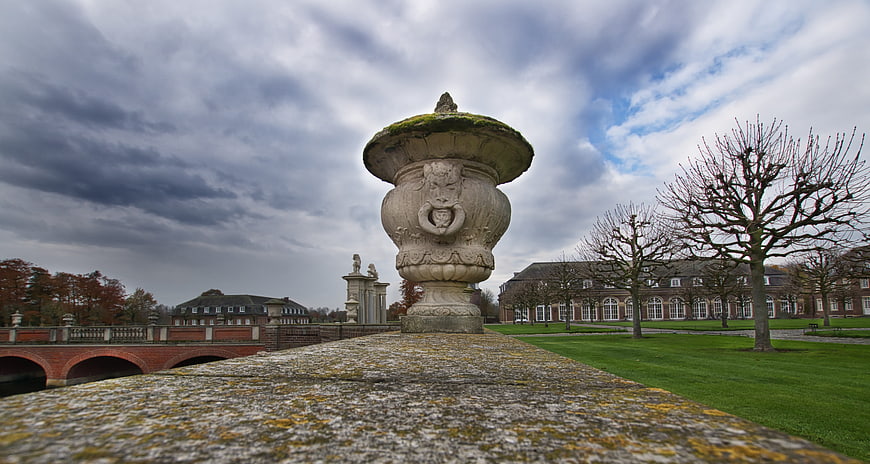 Stone Urn on Bridge Wall with Castle and Cloudy Sky