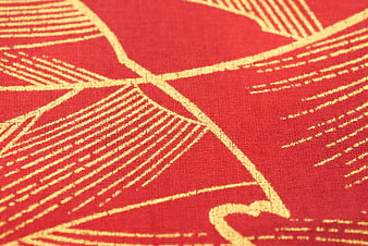 Red and gold textured fabric pattern close-up