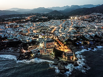 Aerial View of Nerja Spain at Dusk with Coastal Lights and Mountains