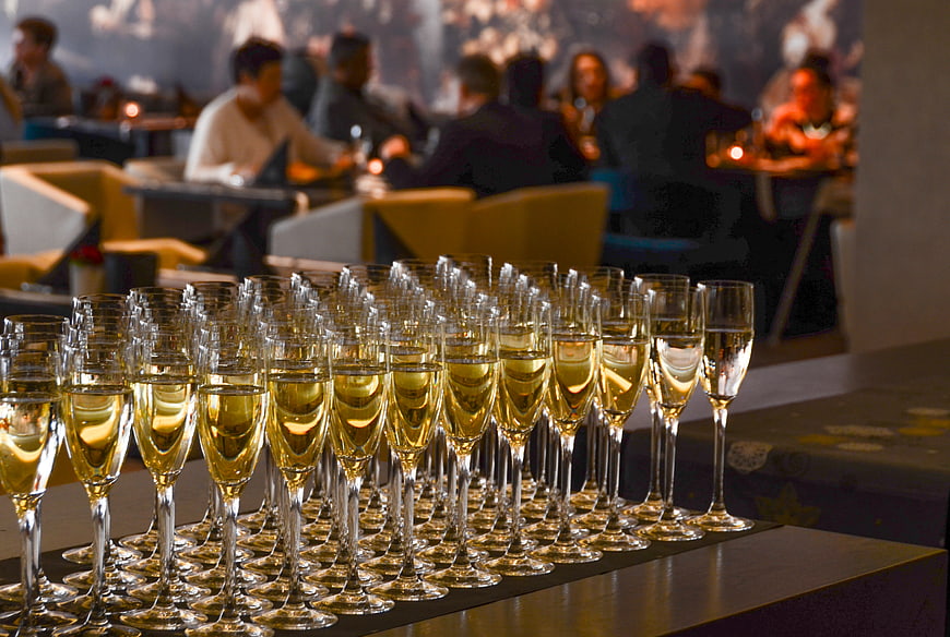 Rows of champagne flutes at a luxury event reception