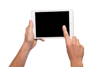 Hands holding white tablet with black screen on white background