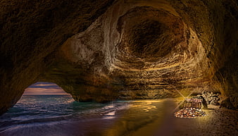 Pirate Treasure Chest Inside Coastal Sea Cave At Dusk