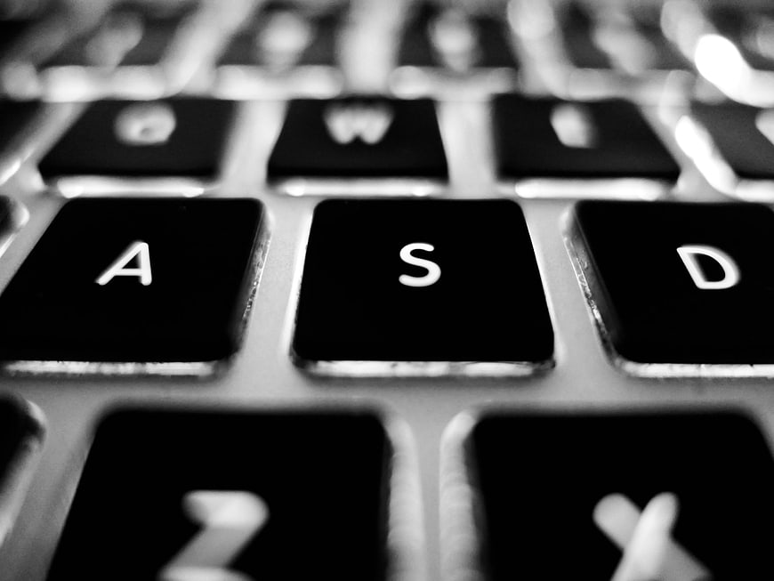 Close-up of laptop keyboard keys in black and white