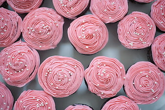 Top View of Pink Frosted Cupcakes with White Sprinkles