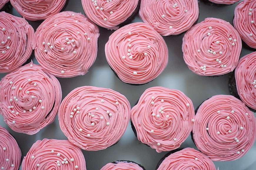 Top View of Pink Frosted Cupcakes with White Sprinkles