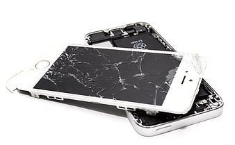 Broken white smartphone with shattered screen on white background