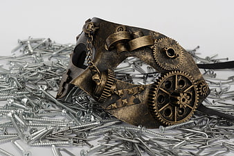 Steampunk Mask With Gears On Pile Of Screws