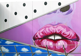 Vibrant Pink Lips Street Art Mural on Urban Building