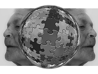 Conceptual Black and White Image of Senior Woman and Puzzle Sphere