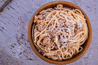Top View of Spaghetti with Meat Sauce in Clay Bowl