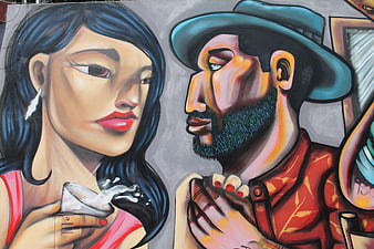 Colorful street art mural of a romantic couple in Peru