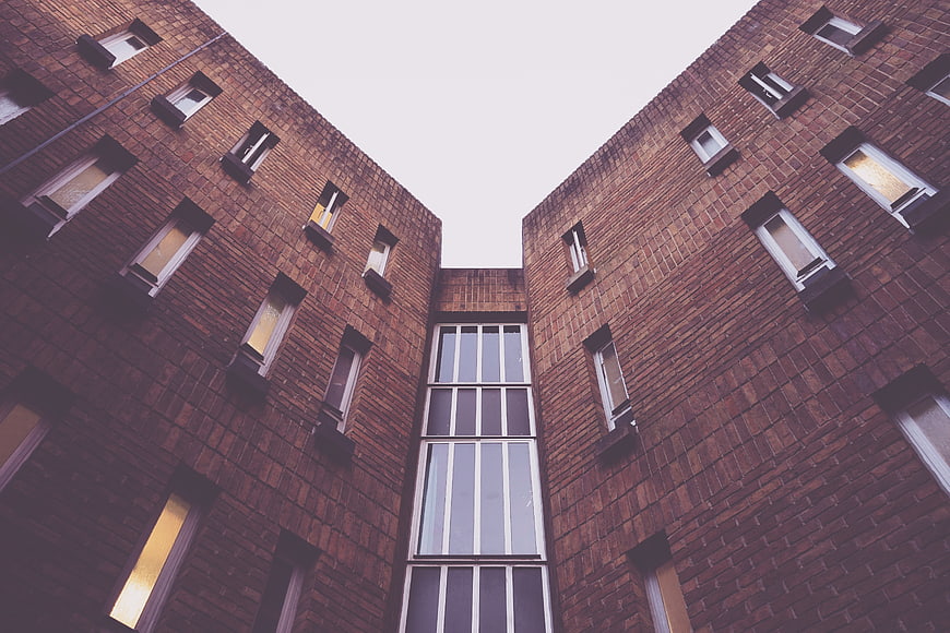 Low angle view of modern brick apartment building facade