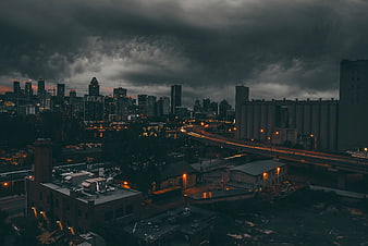 Dramatic Night Cityscape with Highway and Skyscrapers