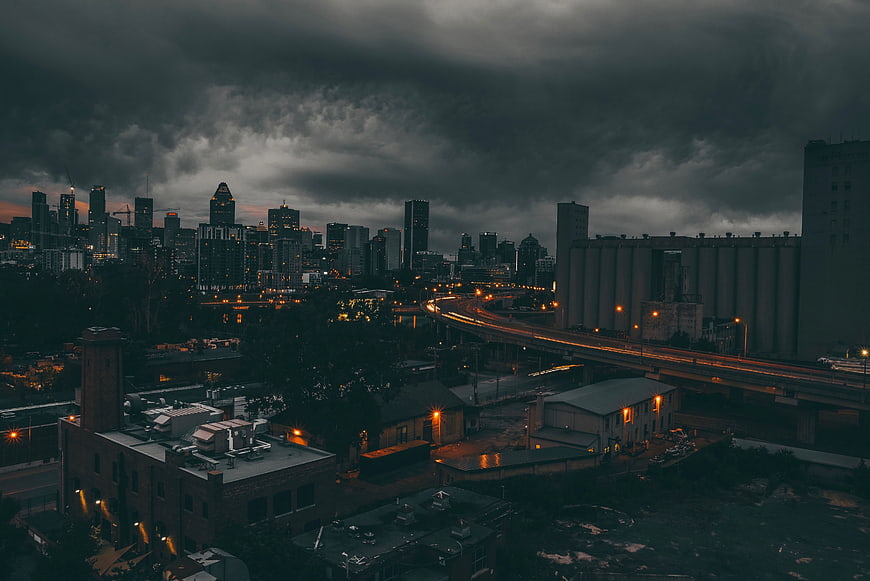 Dramatic Night Cityscape with Highway and Skyscrapers