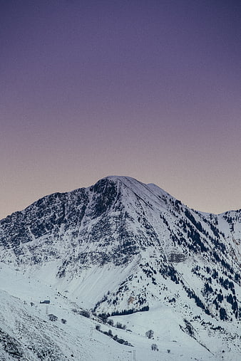 Snowy Mountain Peak at Dusk with Purple Sky
