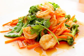 Shrimp Stir Fry with Broccoli and Carrots on White Plate