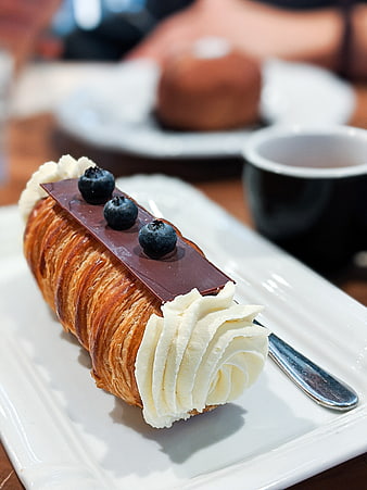 Chocolate Blueberry Cream Horn Pastry on White Plate